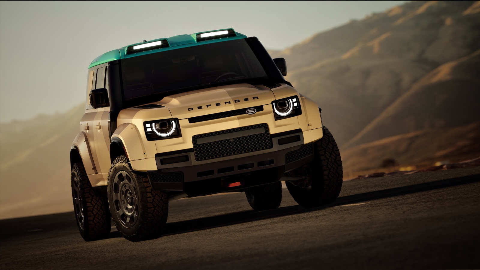 DEFENDER DAKAR のフロントビュー。引き上げられた最低地上高と拡大されたトレッド幅がわかる